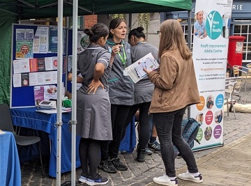 Here for Health team talking to a member of the public