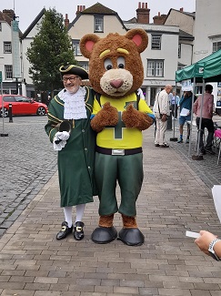 The town Crier with the bear mascot